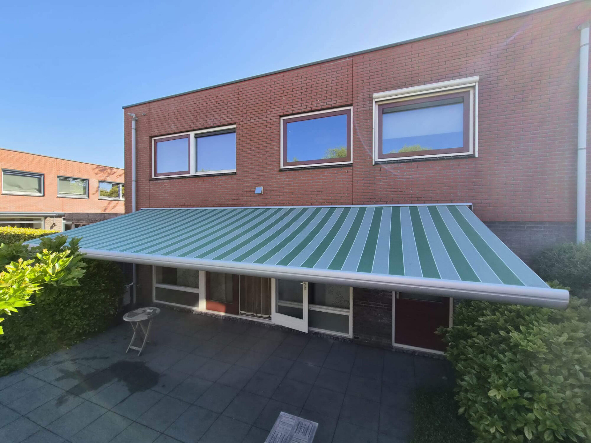 Onderhoud woerden breed knikarmscherm terras doek
